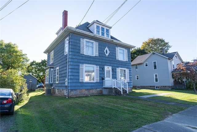 view of front of property with a front lawn