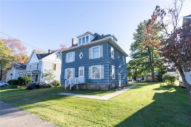 view of front of house with a front lawn