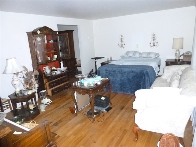 bedroom with wood-type flooring