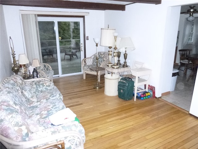 interior space with beamed ceiling and hardwood / wood-style flooring