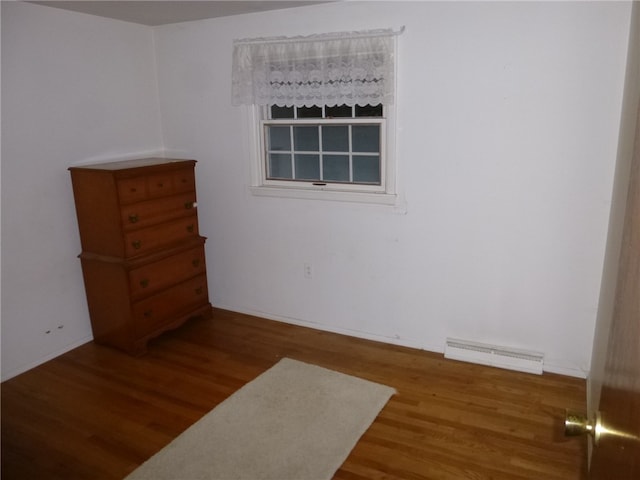 spare room featuring hardwood / wood-style flooring