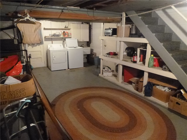 basement with separate washer and dryer and sink