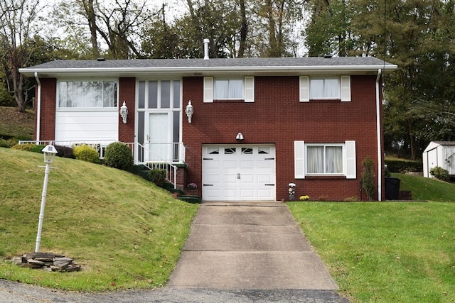 view of front of property with a garage and a front lawn