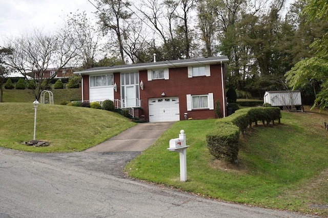 view of front of property featuring a front yard, a garage, and a storage unit