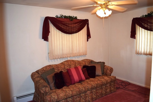 sitting room with ceiling fan, carpet floors, and a baseboard heating unit