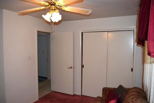 unfurnished bedroom with carpet floors, a closet, and ceiling fan