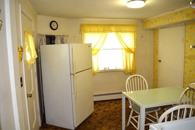 720 Pollard St, Monessen, PA 15062 - kitchen with crown molding, freestanding refrigerator, and a baseboard radiator