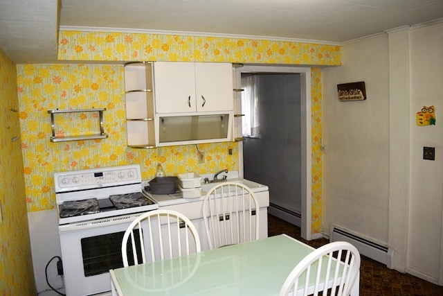 kitchen with electric range, crown molding, a baseboard heating unit, and white cabinetry