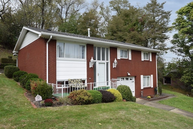 view of front of property with a garage and a front yard