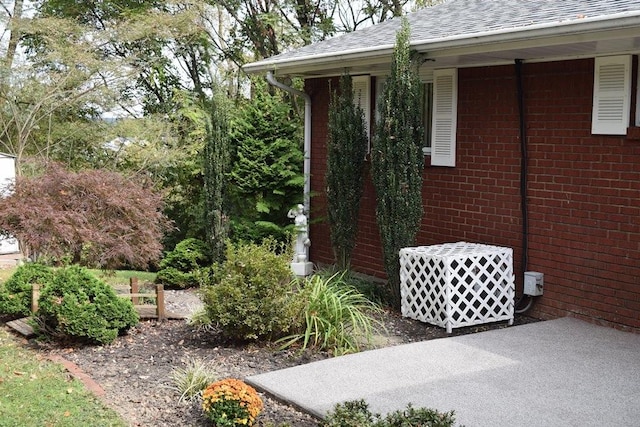 720 Pollard St, Monessen, PA 15062 - view of side of home with brick siding and a shingled roof