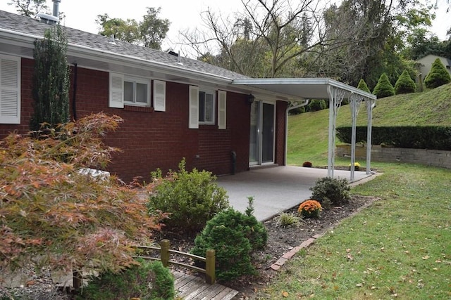 720 Pollard St, Monessen, PA 15062 - exterior space with brick siding, a yard, and a patio