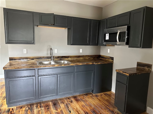 kitchen with dark wood-type flooring and sink