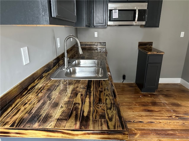 kitchen with dark hardwood / wood-style floors and sink