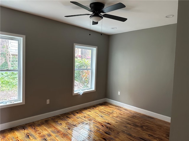 empty room featuring ceiling fan and light hardwood / wood-style flooring