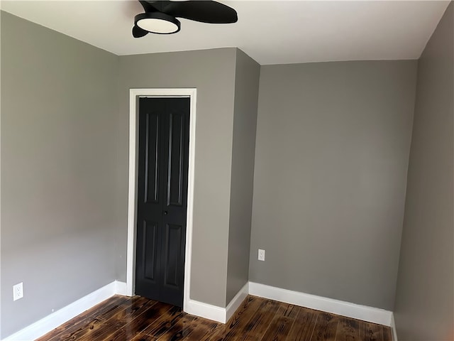 unfurnished room with dark hardwood / wood-style floors