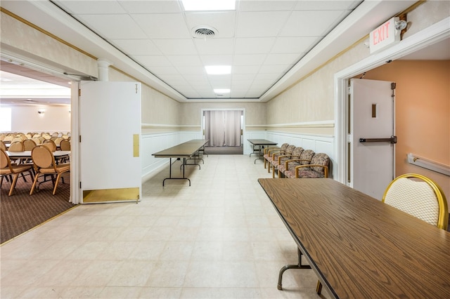 dining room featuring a drop ceiling