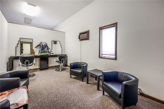 living area with a wall unit AC and carpet