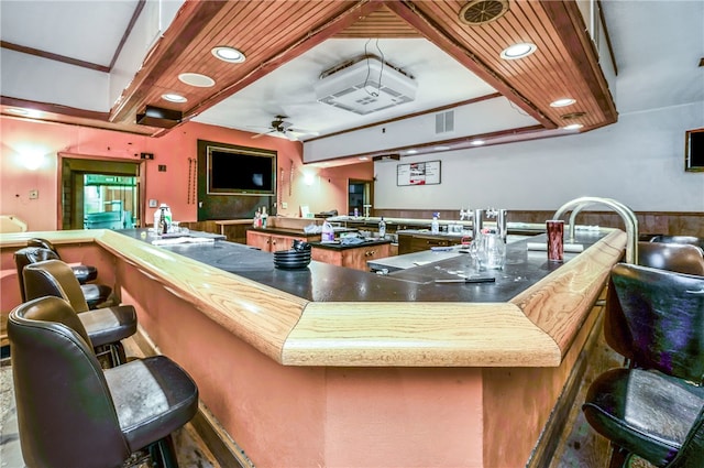 bar with ceiling fan and wooden ceiling