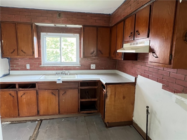 kitchen featuring sink, light hardwood / wood-style floors, and decorative backsplash