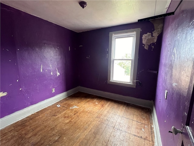 empty room with wood-type flooring