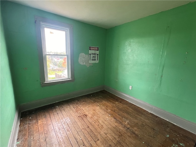 unfurnished room featuring dark hardwood / wood-style flooring