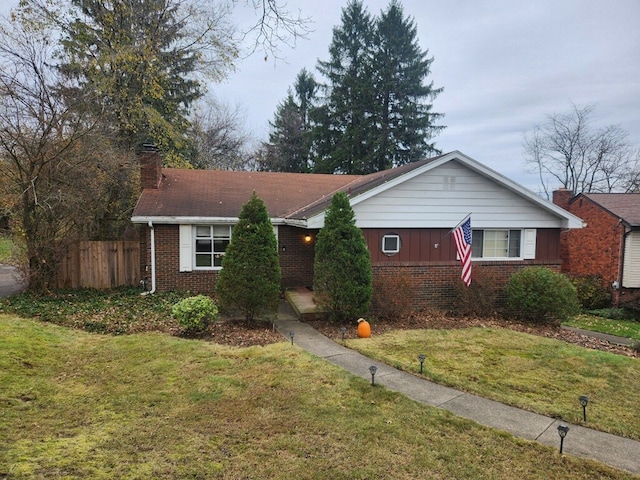 single story home featuring a front yard