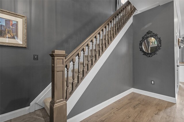 stairs with wood-type flooring