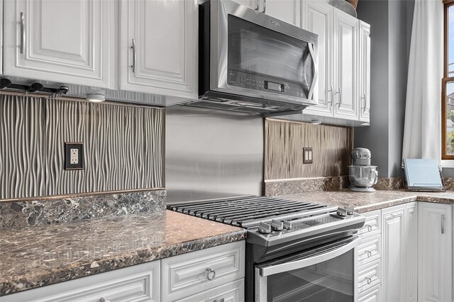 kitchen featuring white cabinets and appliances with stainless steel finishes