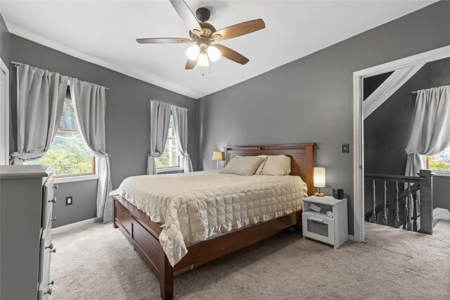 bedroom featuring light colored carpet and ceiling fan