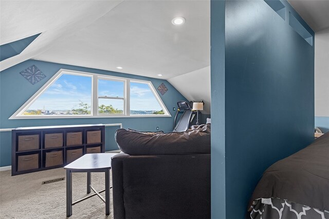 carpeted bedroom featuring lofted ceiling