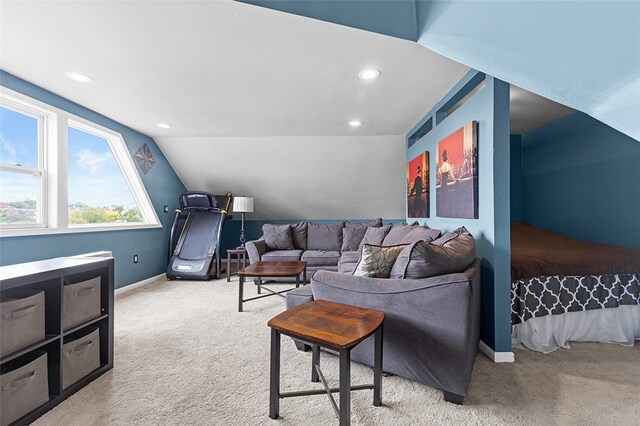 carpeted living room with vaulted ceiling