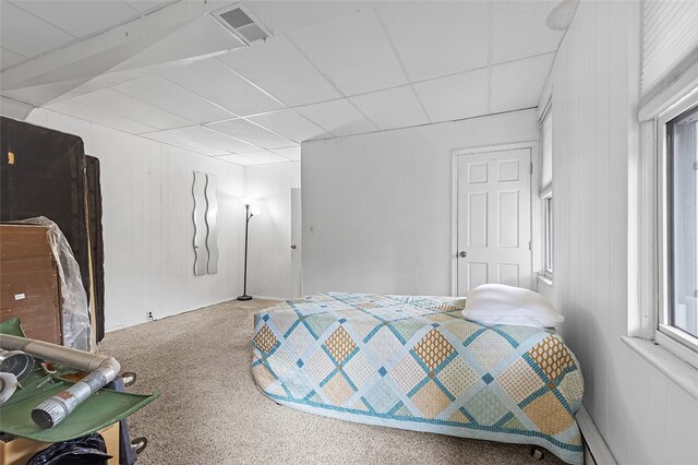 bedroom featuring baseboard heating and carpet floors