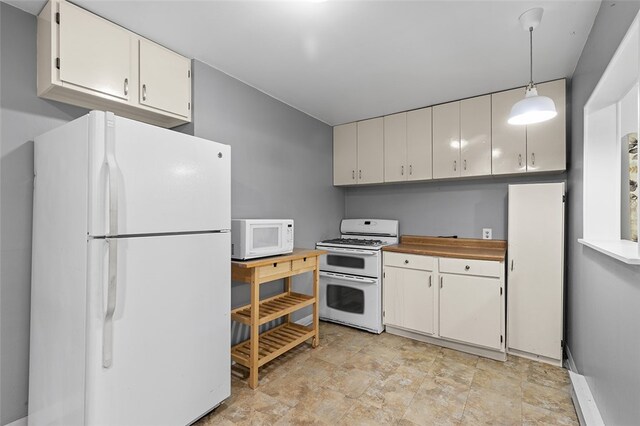 kitchen with pendant lighting, white cabinets, and white appliances