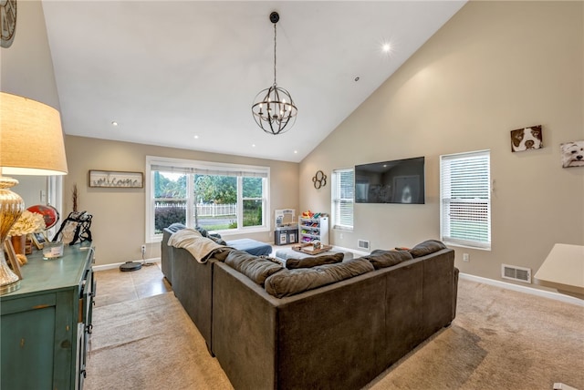 carpeted living room featuring high vaulted ceiling and a chandelier