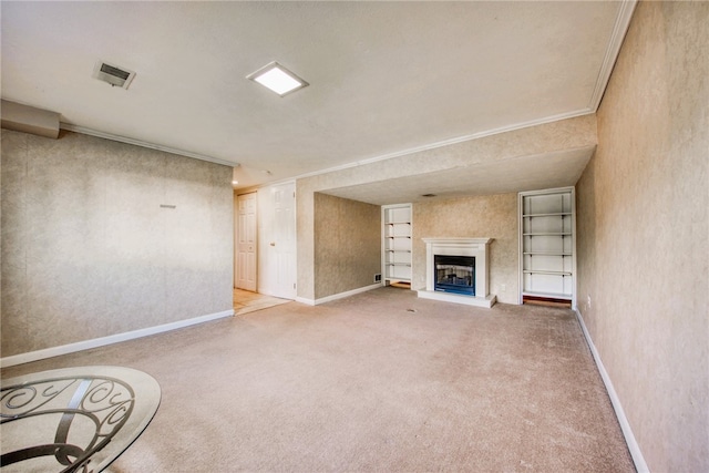 unfurnished living room with carpet floors, built in features, and crown molding