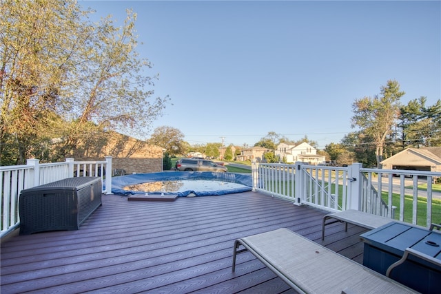 deck with a covered pool