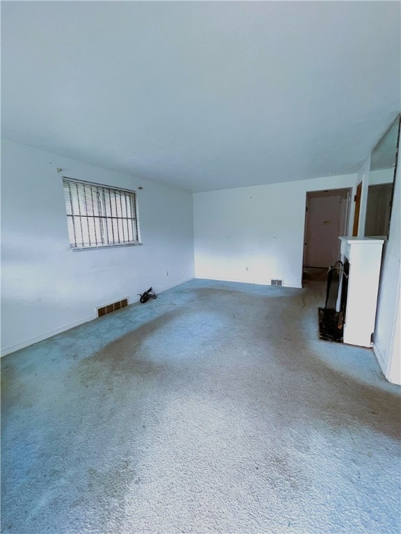 unfurnished living room with carpet