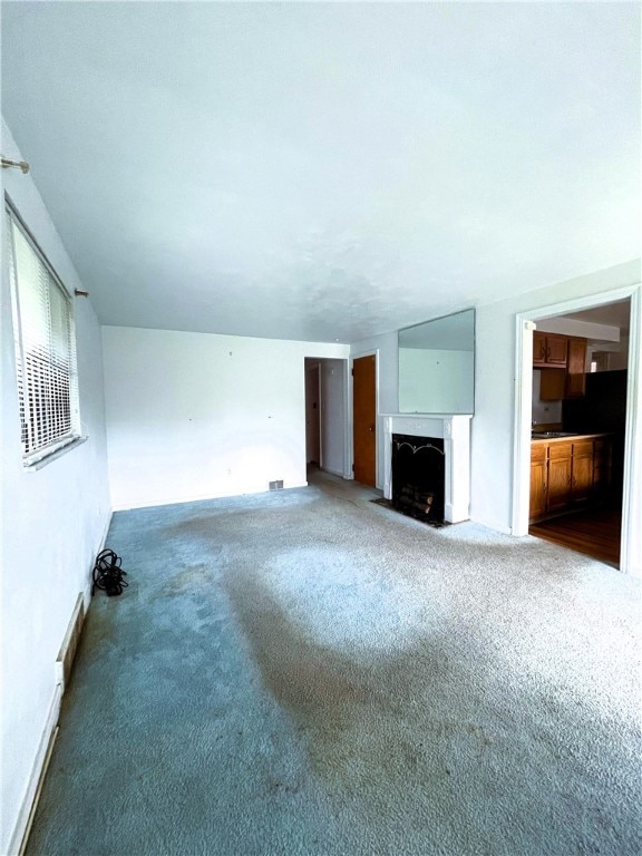 unfurnished living room with carpet floors