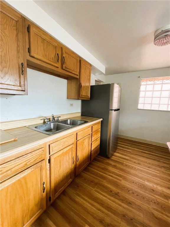 kitchen with sink and dark hardwood / wood-style flooring