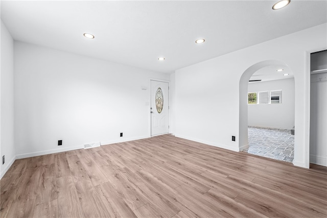 spare room with light hardwood / wood-style flooring