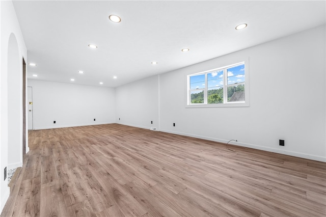 unfurnished room with light wood-type flooring