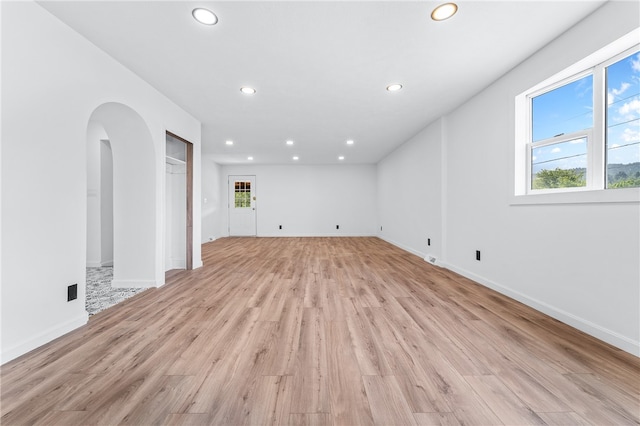 spare room with light wood-type flooring