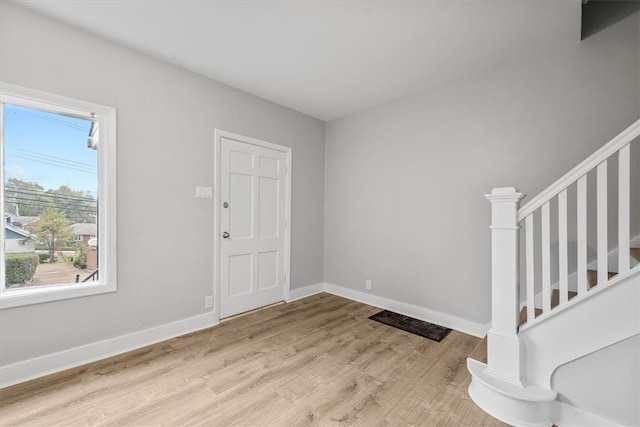 foyer entrance with light wood-type flooring