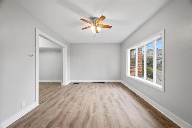 unfurnished room featuring ceiling fan and light hardwood / wood-style floors