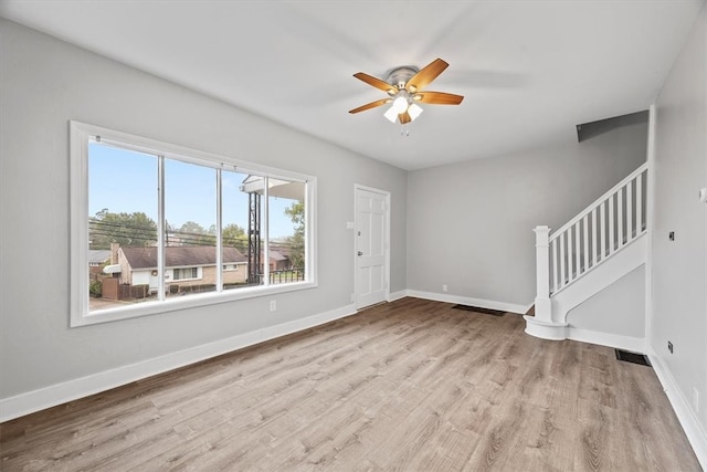 empty room featuring light hardwood / wood-style flooring and ceiling fan