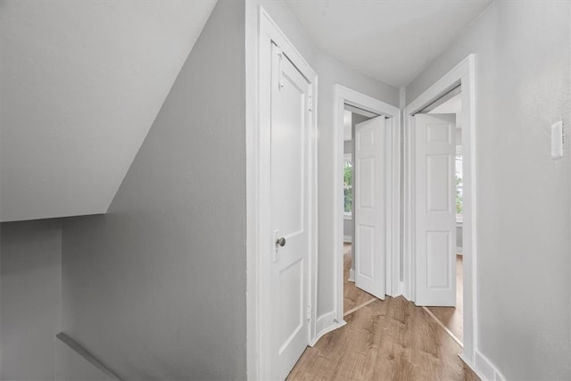 hallway with light wood-type flooring