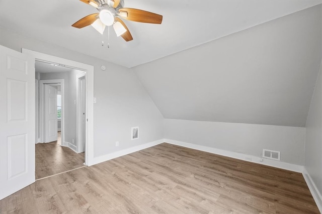 bonus room with lofted ceiling, ceiling fan, and hardwood / wood-style floors