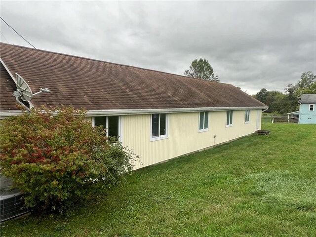 view of home's exterior with a yard