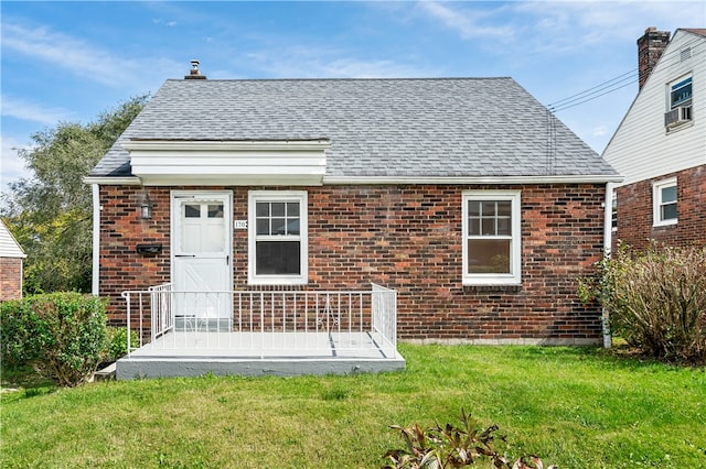 back of house with a yard