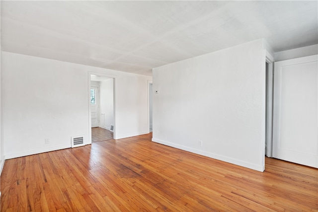 unfurnished room featuring light hardwood / wood-style floors